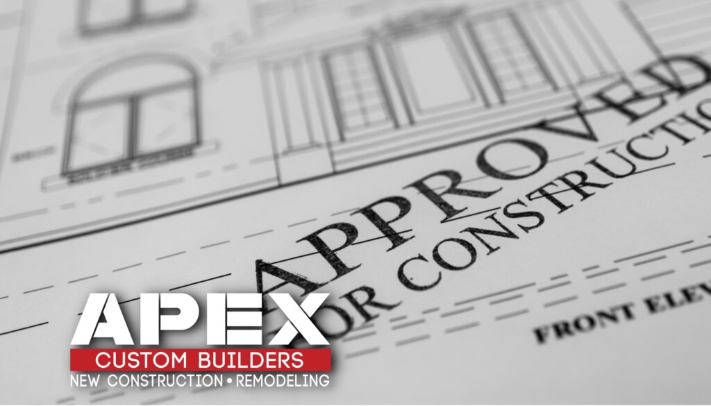 Blueprint of a house with a stamp reading 'Engineer-Approved Plans' on a desk, symbolizing the necessity of Florida engineer approval for building a home with purchased house plans online.